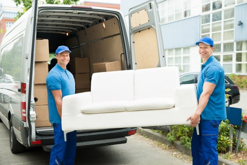 Professional movers handling local removals in Barbican near apartment buildings