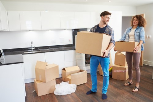 Professional movers handling boxes for small removals in Barbican