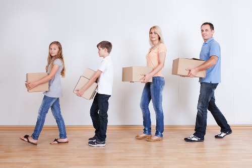 Professional movers handling boxes in central London